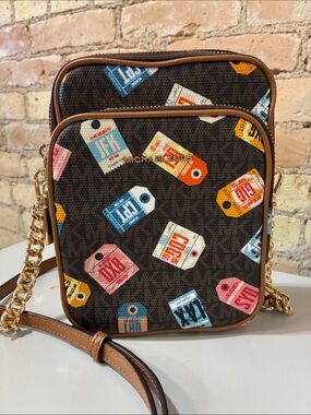 Michael Kors Jet Set Smartphone Crossbody with Multicolor Luggage Tag Print.